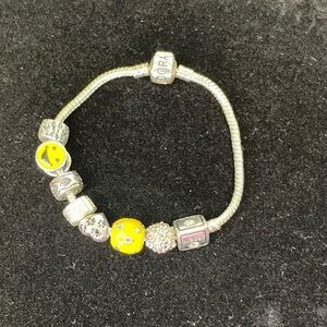 Authentic Pandora Silver Charm Bracelet with 8 charms.